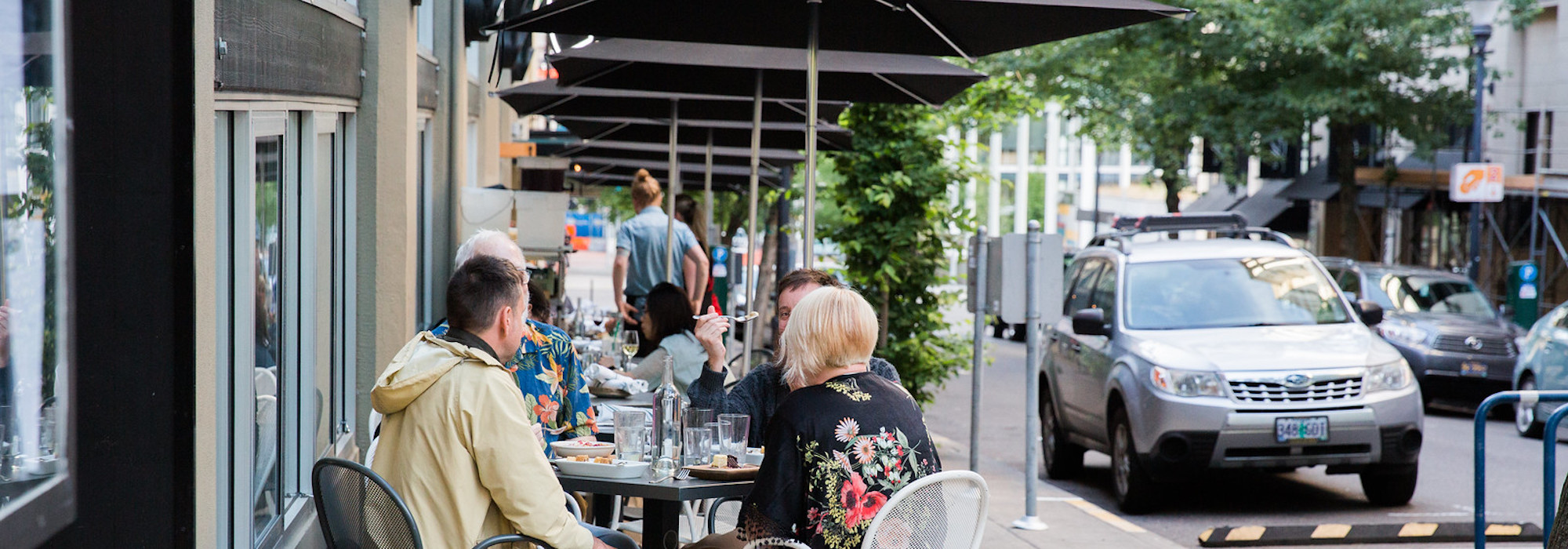 people eating at a sidewalk cafe